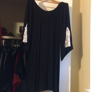 Black off the shoulder dress.